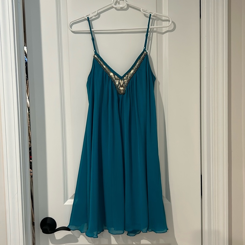 Express teal blue spaghetti strap chiffon flowy dress with gold accent.